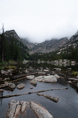 Misty morning view of lake and mountains in Rocky Mountain National Park