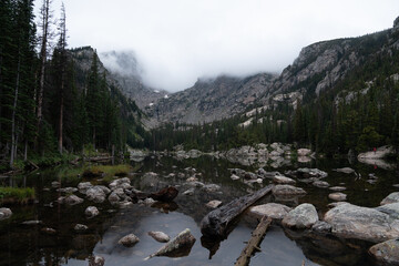 Misty morning view of lake and mountains in Rocky Mountain National Park