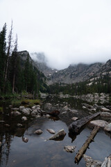 Misty morning view of lake and mountains in Rocky Mountain National Park