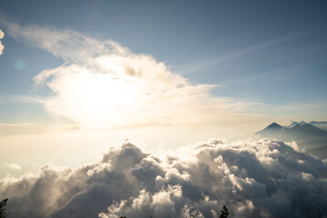  sunset view above the clouds, seen from the summit of Acatenango volcano in Guatemala.