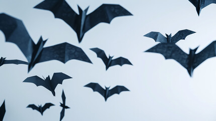 Naklejka premium Halloween and decoration concept - paper bats flying, creating a spooky atmosphere.