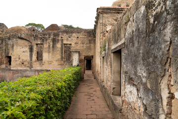 Fototapeta premium Colonial ruins and lush garden in Antigua Guatemala