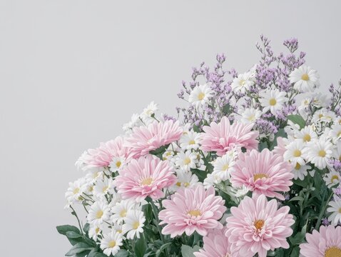 Beautiful arrangement of pink and white flowers with greenery against a light background for decorations or floral designs in various creative projects