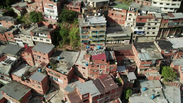Tilt-up aerial shot showing densely packed homes in Petare, Miranda, Venezuela