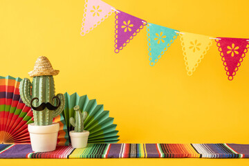 Celebratory image featuring a decorative cactus with accessories surrounded by vibrant festive decorations