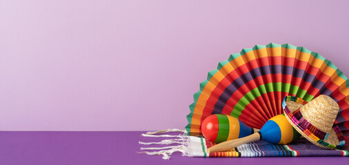 Festive colorful decorations including maracas and a fan on a warm purple backdrop