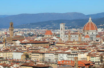 view from above of Florence in Italy with the most famous monuments from left to right: Palazzo Vecchio Tower, Giotto s Campanile, and the Duomo s Dome