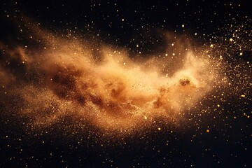 Fototapeta premium Golden dust explosion on black background. Ideal for designs needing a cosmic, luxury, or energetic feel.