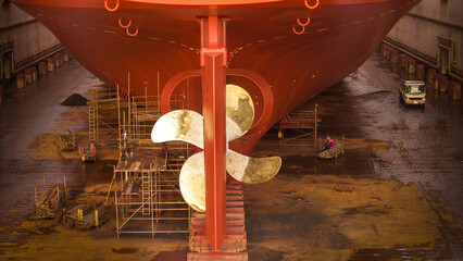 Propeller of large ship spinning power working and water splash contrail . Close up image detail...