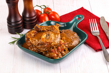 Italian cuisine - ossobuco with sauce