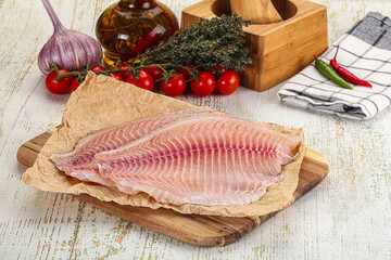 Raw Tilapia fish fillet slice