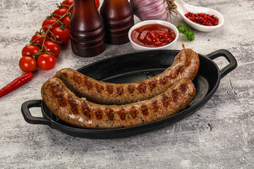 Grilled beef sausages with sauce