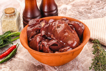 Raw uncokked chicken liver in the bowl
