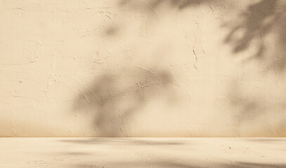 Empty beige background with sunlight superimposed shadow leaves on the wall. autumn background template for product presentation concept.