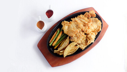 chicken steak, vegetables and sauce