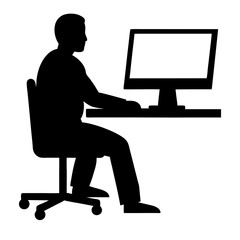 Silhouette of a person working on a laptop at a desk in an office