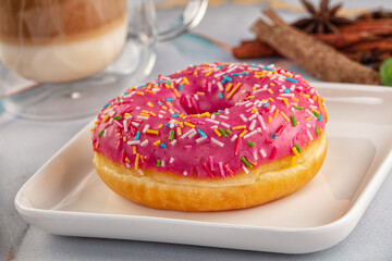Sweet donut with strawberry icing