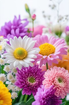 Colorful Floral Arrangement with White, Yellow, Pink, and Purple Flowers in a Bright and Cheerful Setting for Decorative or Artistic Use