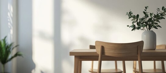Fototapeta premium A wooden dining table with a white vase of flowers on it