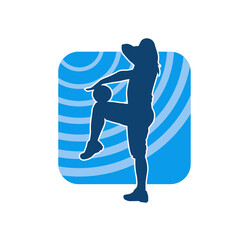 Silhouette of a slim sporty woman doing stretching exercise using gym ball. Silhouette of a sporty female doing physical workout using fitness ball. 