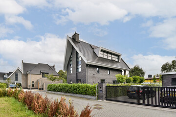 A contemporary residential area featuring sleek buildings and well-maintained landscaping, blending modern design with natural elements.