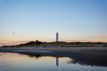 lighthouse and reflections at sunrise