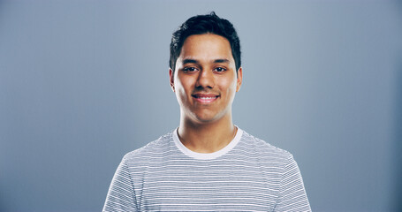 Smile, confidence and portrait of man in studio with mockup space, creative or university...
