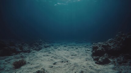 Dark Blue Ocean Underwater Scene with Coral Reef and Sandy Seabed