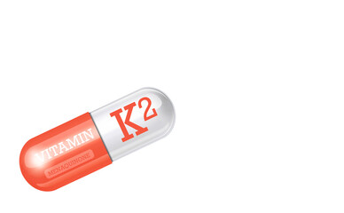 Vitamin K2. Menaquinone.Capsule tablet on white background. Copy space.