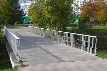 White pedestrian bridge in the city park, urbanism, Yuzhnoye Butovo, Moscow, 5