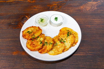 Delicious homemade potato pancakes served with creamy dips