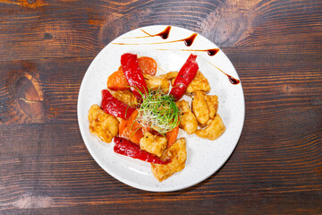Colorful chicken stir-fry with peppers and vegetables on a plate