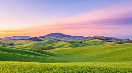 Obraz premium Serene Rolling Hills Landscape at Sunset with Vibrant Colors and Soft Sky Hues