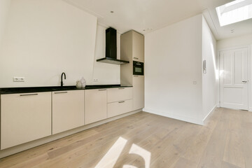 A sleek and contemporary kitchen featuring clean lines, minimalist cabinetry, and a bright open space, perfect for modern living and cooking.