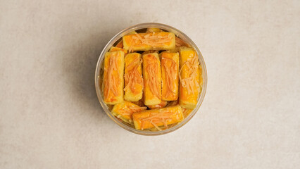 Kastengel cake is a savory cheese cake or cheese stick that originates from the Netherlands. This cake is popular for celebrations such as Eid al-Fitr. kastengel in a jar