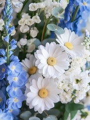 Fresh and Vibrant Floral Arrangement with Delicate White Daisies, Blue Delphiniums, and Eucalyptus Leaves for Home Decor or Event Styling