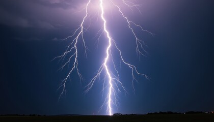 Dramatic Night Lightning Bolt Illuminates Dark Field with Trees. A lightning bolt strikes in the sky over a field.