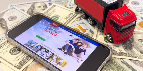  miniature machine with banknotes and coins ,distribution and import export or money concept.