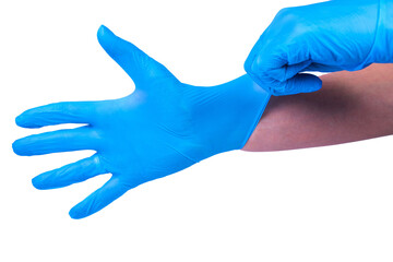 Doctor puts on sterile medical gloves. White background.