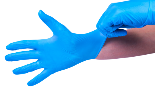 Doctor puts on sterile medical gloves. White background.
