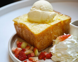 Honey toast on a plate with sweet fruits