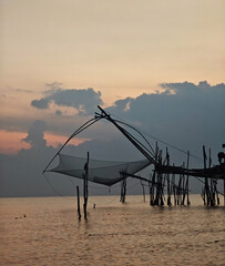 Square net dipped into the lake to catch fish