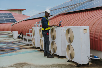 Fototapeta premium Engineers are checking the air conditioning and cooling system in a commercial building.(PHOTO)