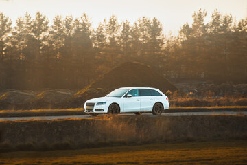 Premium white wagon in rural landscape