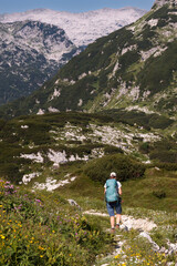 Naklejka premium Mountaineer hiking on early morning, Triglav National Park, Slovenia