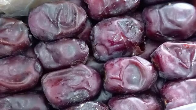 Dried date fruit in plastic box. Close-up. Top view.photo taken in malaysia