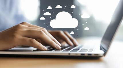 Closeup Hands Typing on Laptop Keyboard with Cloud Computing Graphic Overlay