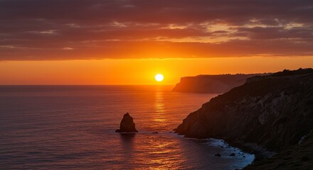 Bright sunset over the sea with small waves. The sun, a large red disk, is reflected in the water, creating a path of fire.