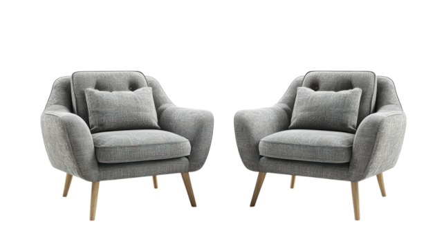 Stylish modern armchairs with decorative pillows arranged in a cozy living room setting