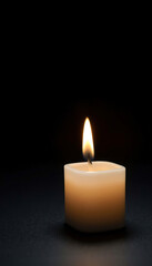 Single Candle in Dark Room